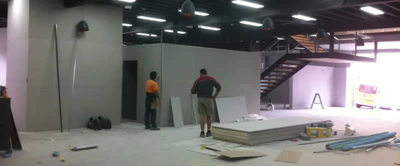 Camperdown fit-out: tradespeople installing plasterboard walls