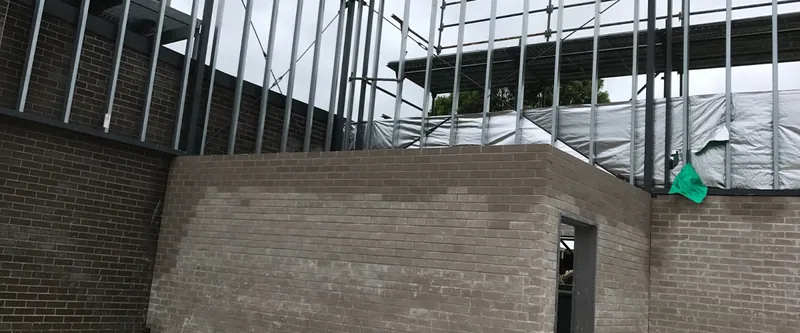 College building: brick wall and steel framing
