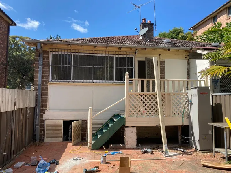 Back of the house and existing stairs before work started